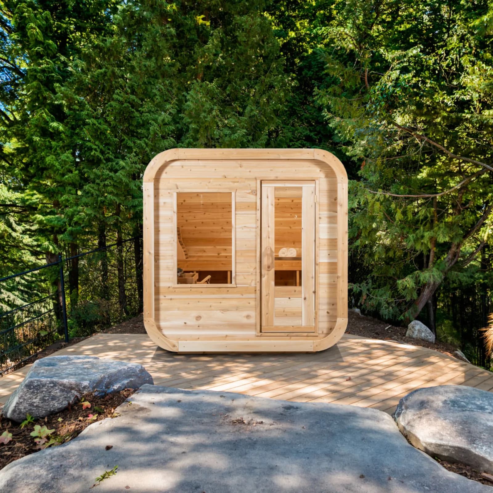 Dundalk Canadian Timber Luna outdoor cedar sauna with rounded-square shape and glass front