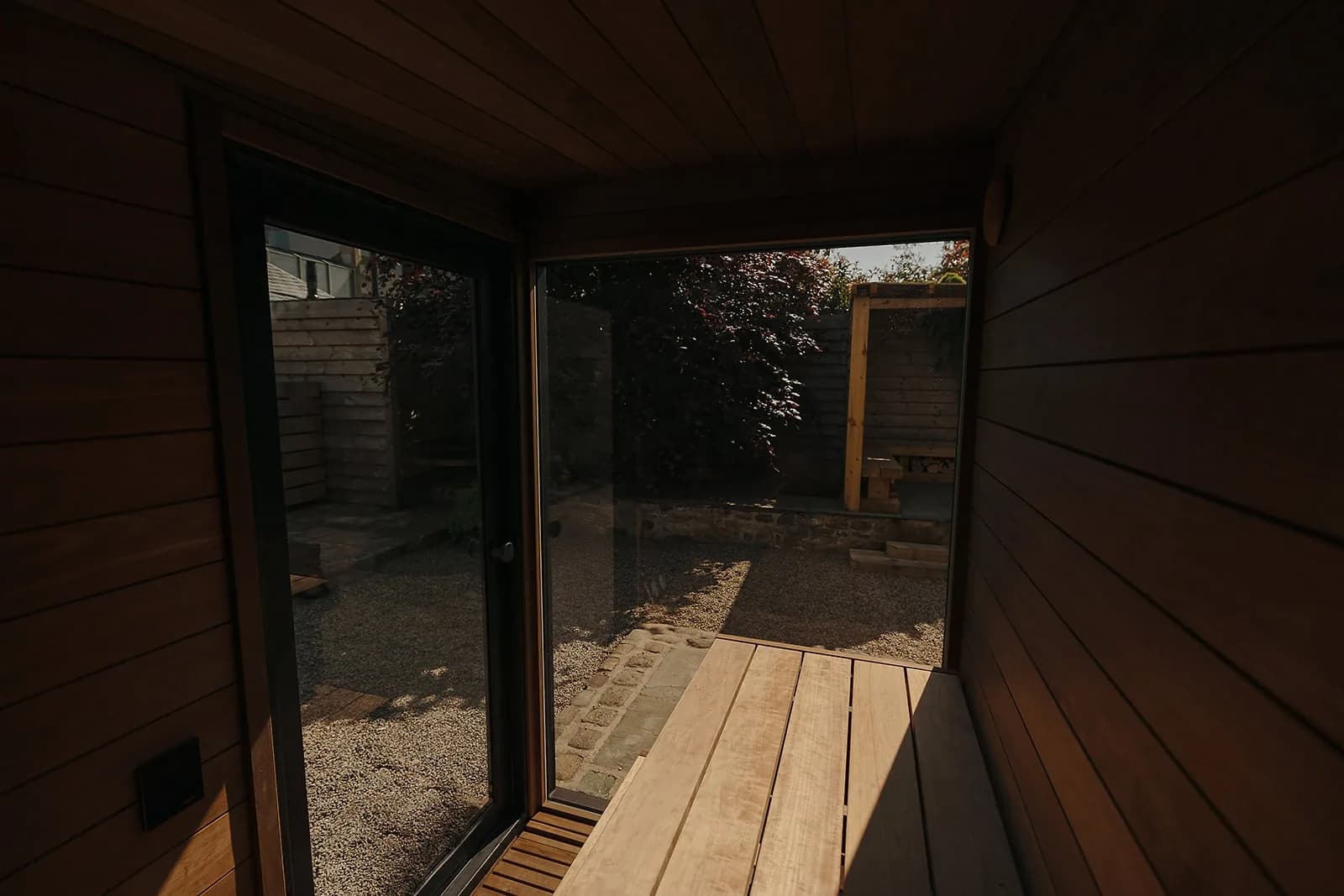 Kirami FinVision Sauna S Misty exterior in black thermal spruce with panoramic glass front