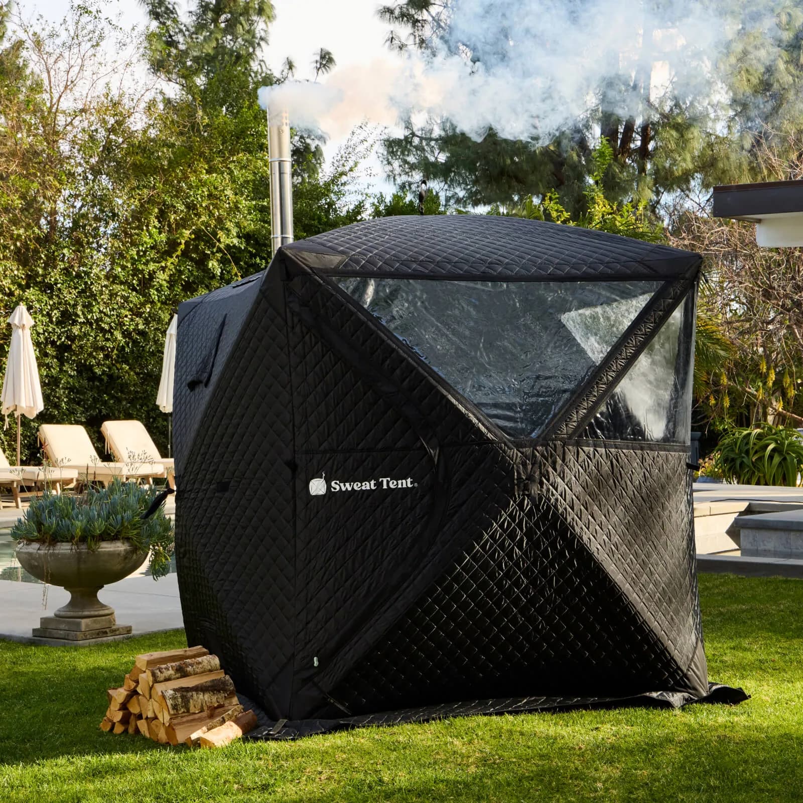 SweatTent regular and camo tent variants set up side by side outdoors