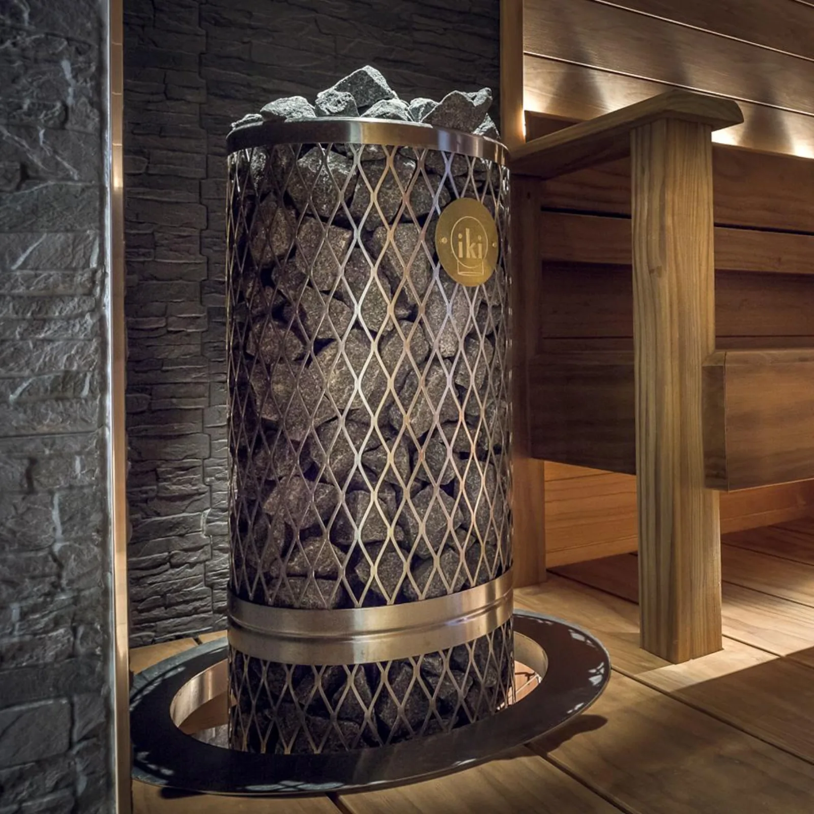 IKI Pillar heater with embedding flange shown on a tiled platform